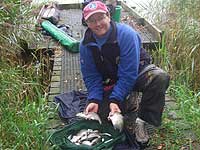 Angler showing the catch of the day